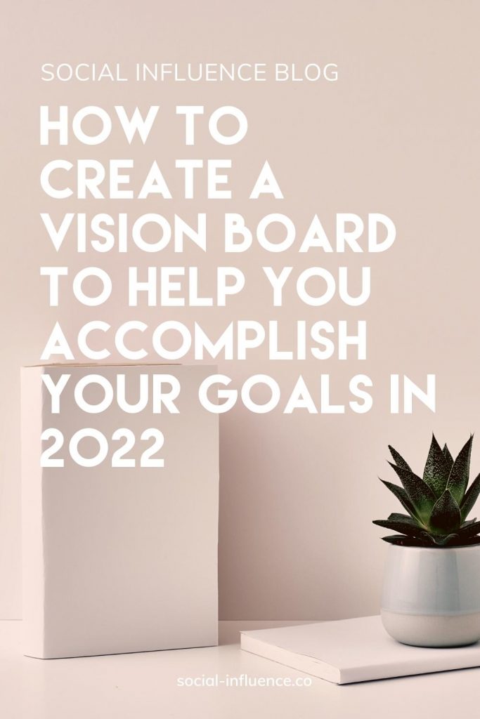 How to Create A Vision Board To Help You Accomplish Your Goals In 2022 written on a background with a white book and a cactus in a pot